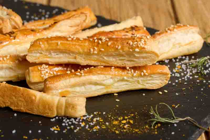 Sticks with sesame and cumin. Homemade cheese sticks. Home baking appetizers