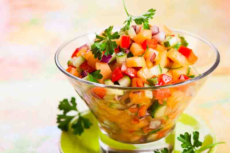 Fresh melon salsa with red pepper and cucumber