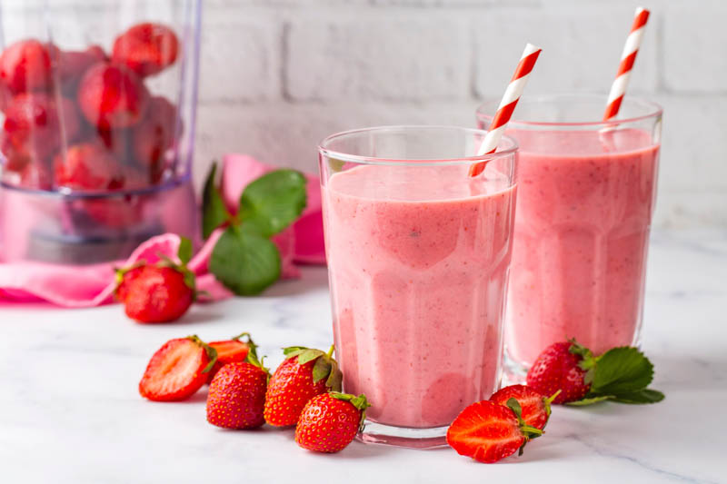 Fresh strawberry smoothies prepared with garden-grown fruit
