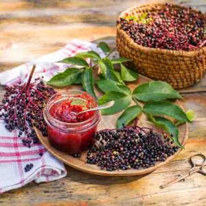 Elderberry jam with fresh ripe berries, sweet and healthy dessert. Making homemade elderberry jam or jelly