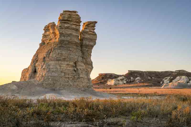 Castle Rock - limestone pillar landmark in prairie of western Kansas near Quinter (Gove County) at late October sunrise